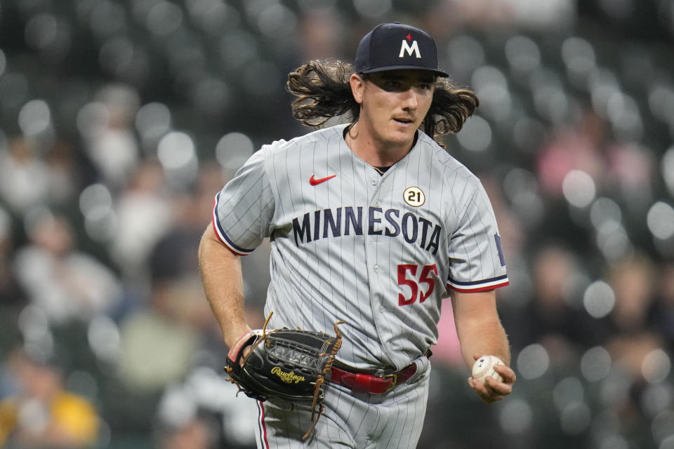 Minnesota Twins relief pitcher Kody Funderburk tosses the ball to first baseman Alex Kirilloff to put out Chicago White Sox's Elvis Andrus to end a baseball game Friday, Sept. 15, 2023, in Chicago. (AP Photo/Erin Hooley)