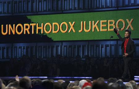 Bruno Mars accepts the award for Best Pop Vocal Album for "Unorthodox Jukebox" at the 56th annual Grammy Awards in Los Angeles, California January 26, 2014. REUTERS/Mario Anzuoni