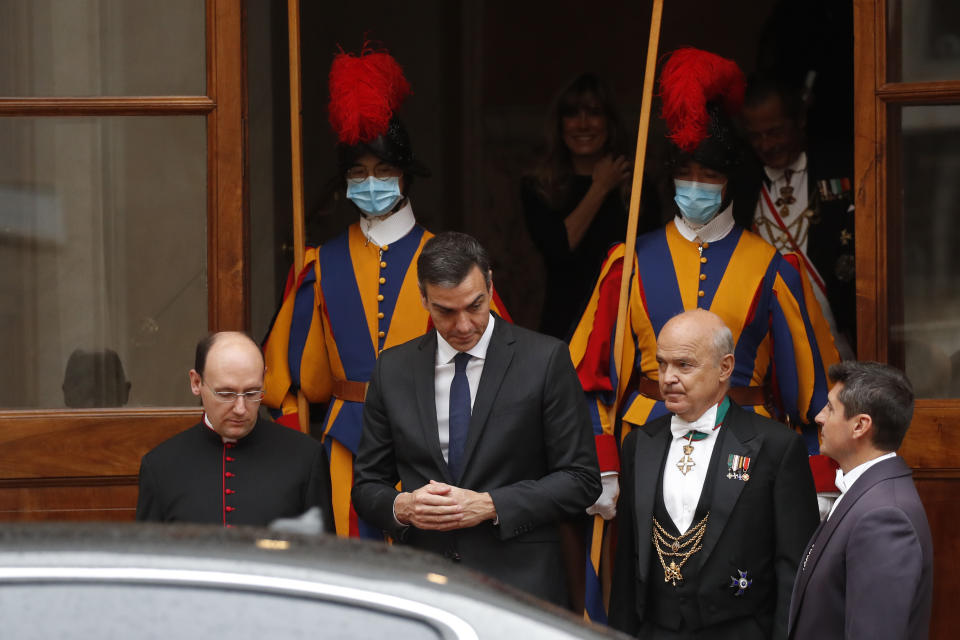 Spain's Prime Minister Pedro Sanchez, center, leaves the San Damaso courtyard after his meeting with Pope Francis, at the Vatican, Saturday, Oct. 24, 2020. (AP Photo/Alessandra Tarantino)