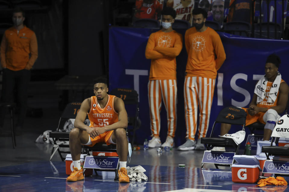 Tennessee forward E.J. Anosike (55) sits on the bench in the final moments of the team's NCAA college basketball game against Florida on Tuesday, Jan. 19. 2021, in Gainesville, Fla. (AP Photo/Matt Stamey)