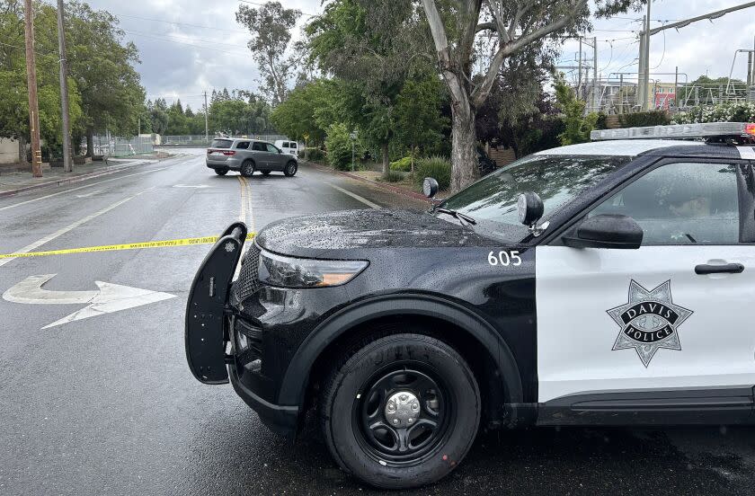 A police cruiser sits at a blocked-off street following a third stabbing in less than a week in the small city of Davis, Tuesday May 2, 2023. A massive police response came around midnight after a 911 call reported that a woman living in a camp of unhoused people had been stabbed repeatedly through the fabric of her tent. Police combed the surrounding area but didn't locate the attacker.