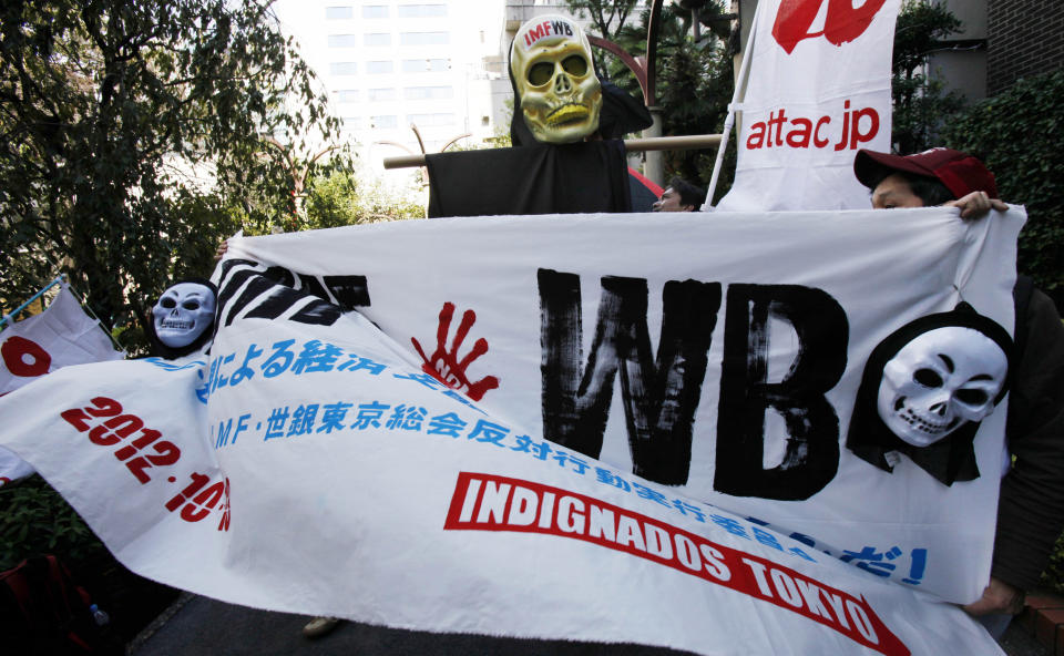 Participants march during a demonstration against the annual meetings of the IMF and World Bank being held in Tokyo, Saturday, Oct. 13, 2012. (AP Photo/Koji Sasahara)