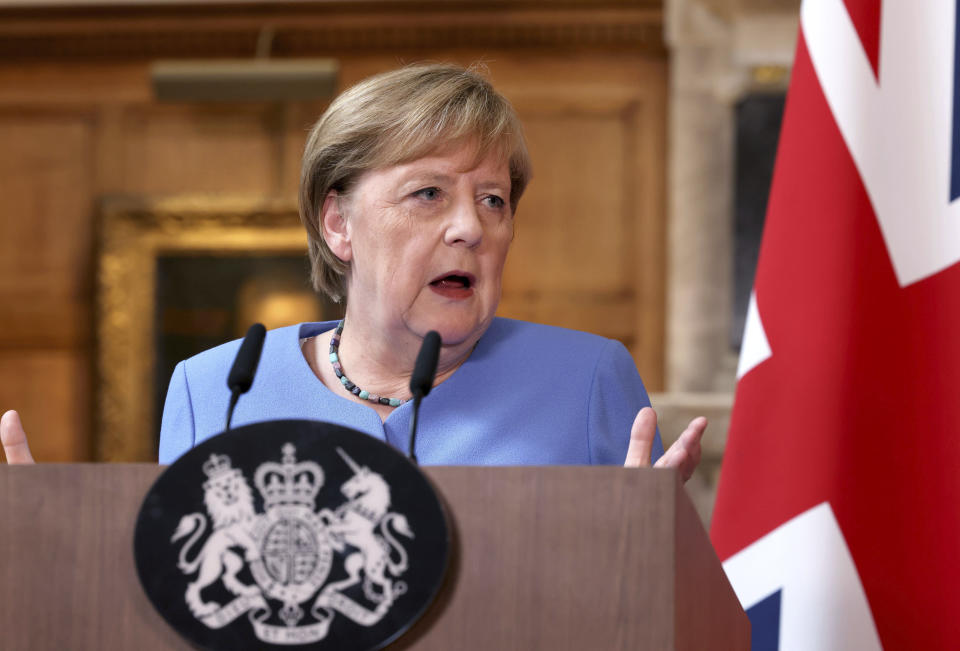 German Chancellor Angela Merkel, takes part in a press conference with Britain's Prime Minister Boris Johnson, after their meeting at Chequers, the country house of the Prime Minister, in Buckinghamshire, England, Friday July 2, 2021. Johnson is likely to push Angela Merkel to drop her efforts to impose COVID-19 restrictions on British travelers as the German chancellor makes her final visit to Britain before stepping down in the coming months. Johnson will hold talks with Merkel at his country residence on Friday. (Jonathan Buckmaster//Pool Photo via AP)