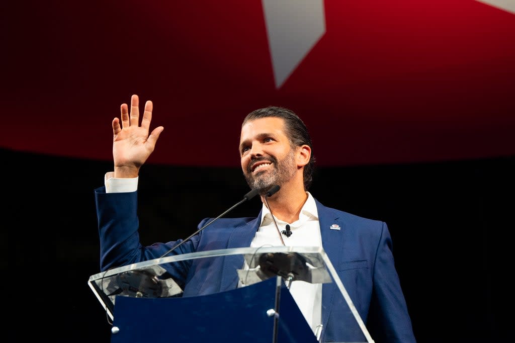 File: Donald Trump Jr waves after speaking during the Conservative Political Action Conference held at the Hilton Anatole on 9 July 2021 in Dallas, Texas (Getty Images)