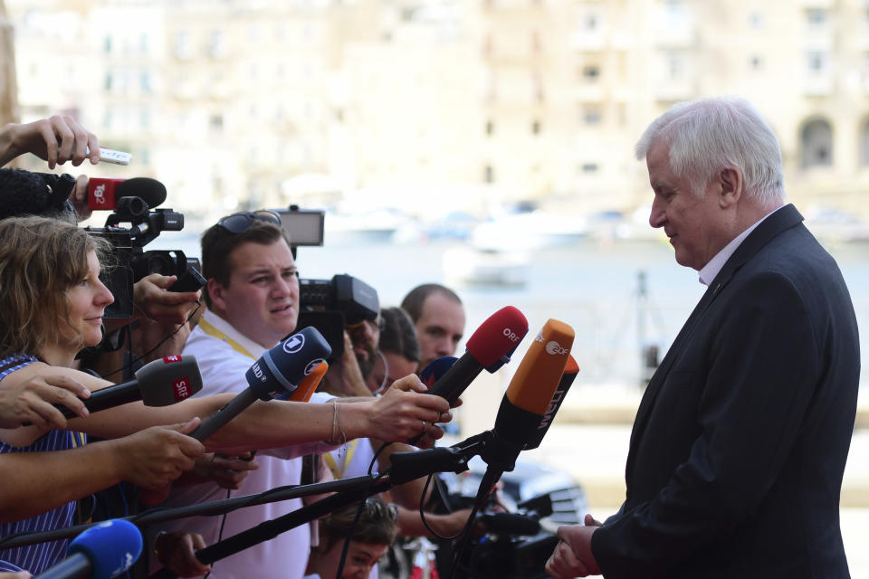 Germany's Interior Minister Horst Seehofer talks with reporters as arrives for an informal meeting of EU interior ministers in Valetta, Malta, Monday, Sept. 23, 2019. The interior ministers from Italy, Malta, France and Germany were meeting in Malta on Monday to develop some automatic mechanism to assure that those rescued at sea will be distributed among other countries and not be the responsibility of the nations where they land. (AP Photo/Jonathan Borg)