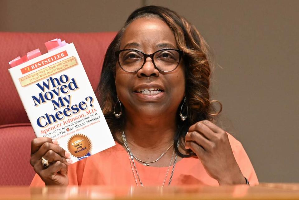 Charlotte-Mecklenburg Board of Education member Lenora Shipp uses the book Who Moved My Cheese? during her explanation of her vote on the south Charlotte boundaries on Tuesday, June 6, 2023.