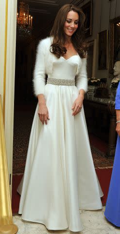 <p>John Stillwell - WPA Pool/Getty</p> Kate Middleton leaves Clarence House to travel to Buckingham Palace for the evening celebrations on her April 29, 2011 wedding day.