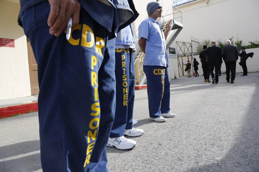 SAN QUENTIN, CALIFORNIA, MARCH 23, 2017: Prioners at San Quentin greet visitors arriving for graduation ceremonies for the Last Mile Works program. Passage of Prop 57 is ushering in a massive overhaul of the prison parole system and with it programs like The Last Mile Works at San Quentin might help to trim the time served by inmates March 23, 2017. The Last Mile Works teach inmates computer coding and other life skills needed to get a job and to keep those jobs after they are released (Mark Boster / Los Angeles Times ).