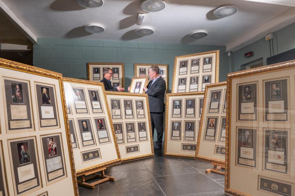 Chris Albury and Hamilton Bland with the framed collection of every signature of Great Britain’s Prime Ministers. Credit: Jamie Gray Photography