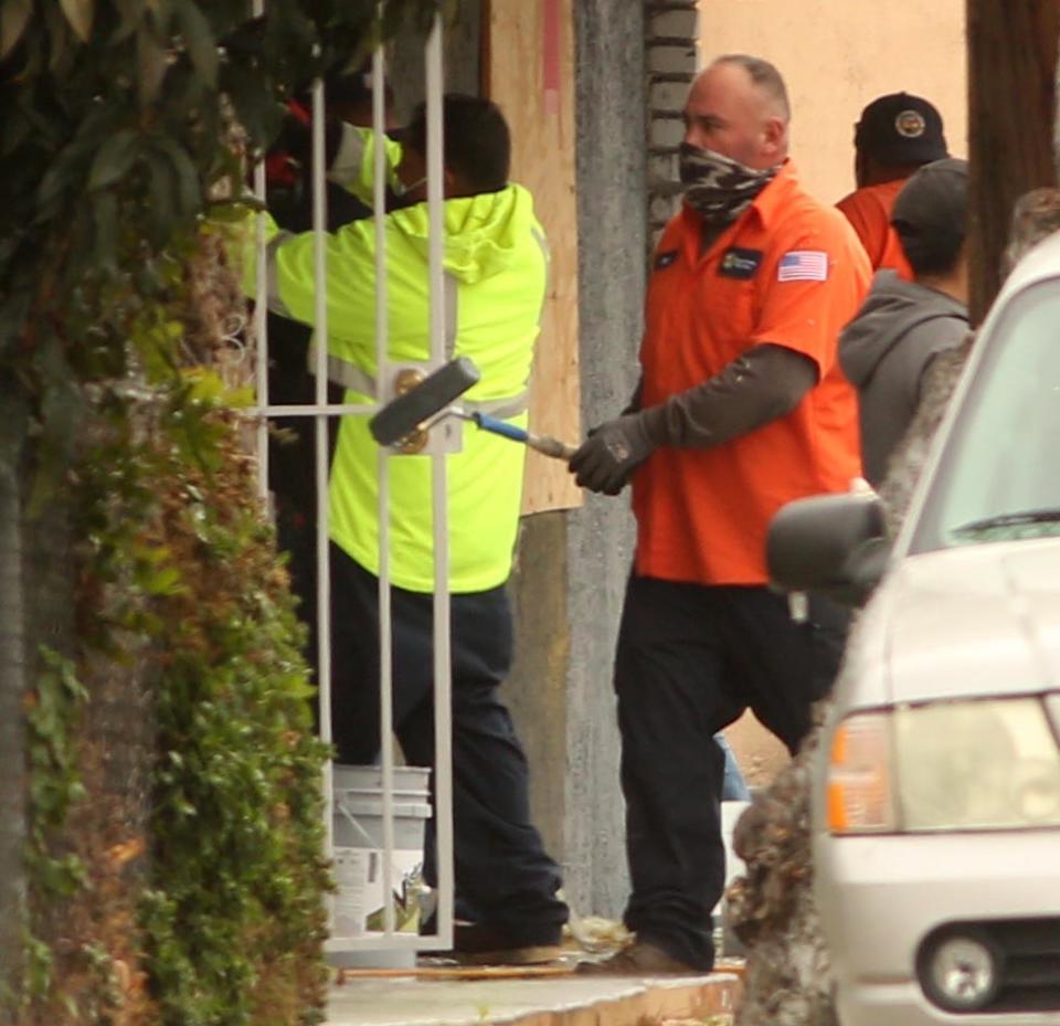 Workers clean up the scene at the church.