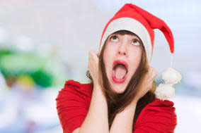 stressed woman wearing a christmas hat, outdoor