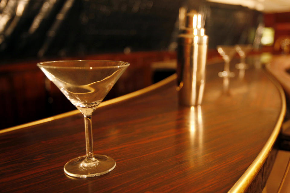 FILE - This Aug. 2, 2010 file photo shows a martini glass and shaker at a bar in San Francisco. On Friday, April 3, 2020, The Associated Press reported on stories circulating online incorrectly asserting that drinking alcoholic beverages can prevent coronavirus. According to Dr. Robert Legare Atmar, an infectious disease specialist at Baylor College, consuming alcohol will not protect against infectious diseases like COVID-19. “Alcohol consumption has long been touted as a means to prevent infection with a variety of pathogens, but there is no evidence that such alcohol consumption protects against any infection. In fact, the evidence is often the opposite – that alcohol consumption is associated with increased risk of infection,” Dr. Atmar told the AP in an email. (AP Photo/Eric Risberg)