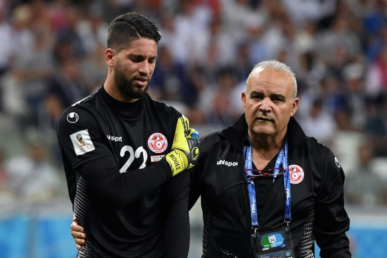 Tunisia goalkeeper Mouez Hassen comes off against England, his World Cup already over