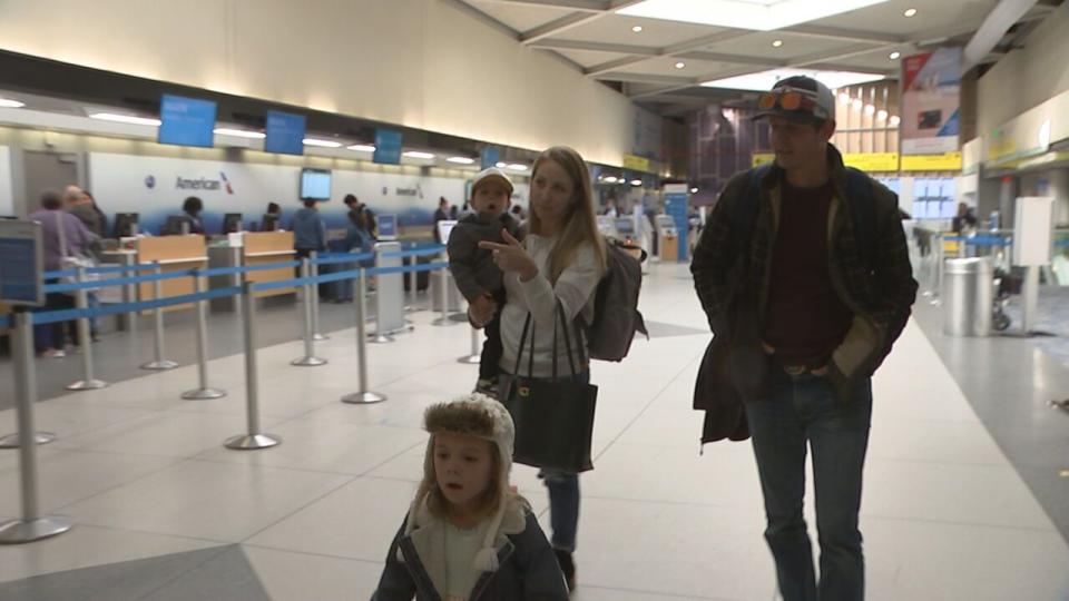 Cassie Ditchfield, her husband and their two small kids in Charlotte-Douglas International Airport on their way to St. Louis for the holiday.