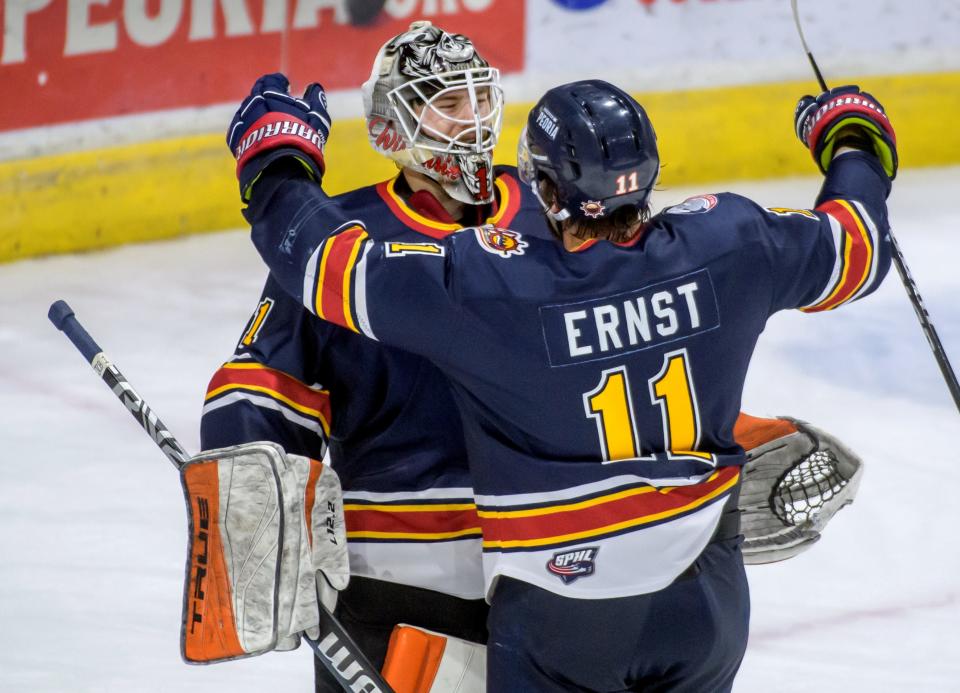 Peoria's Jordan Ernst hugs goaltender Jack Berry after the Rivermen defeated the Roanoke Rail Yard Dawgs 7-3 in Game 2 of the SPHL finals Friday, April 29, 2022 at Carver Arena in Peoria.