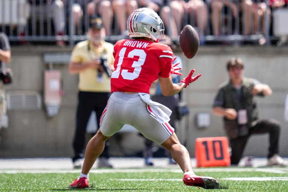 Apr 15, 2023; Columbus, Ohio, United States;  Ohio State Buckeyes wide receiver Kaleb Brown (13) receives the ball during the first quarter of the Ohio State Buckeyes spring game at Ohio Stadium on Saturday morning. Mandatory Credit: Joseph Scheller-The Columbus Dispatch