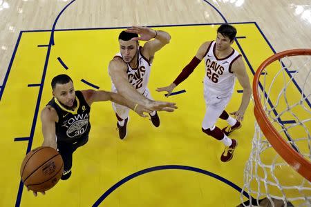 June 3, 2018; Oakland, CA, USA; Golden State Warriors guard Stephen Curry (30) shoots the ball against Cleveland Cavaliers forward Jeff Green (32) in game two of the 2018 NBA Finals at Oracle Arena. Marcio Jose Sanchez/pool photo via USA TODAY Sports