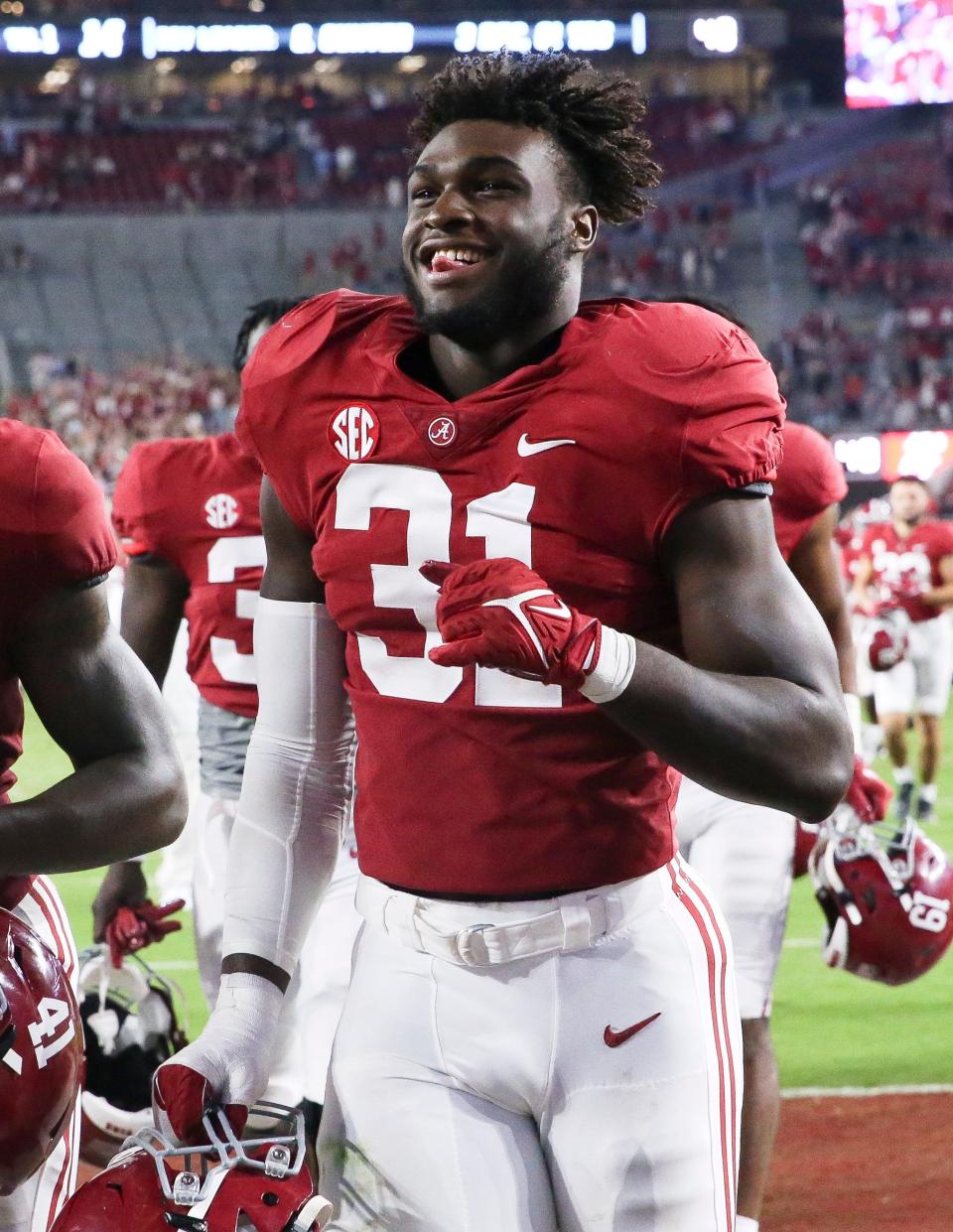 Sep 25, 2021; Tuscaloosa, Alabama, USA;  Alabama linebacker Will Anderson Jr. (31) has a big smile as he leaves the field at Bryant-Denny Stadium. Alabama defeated Southern Miss 63-14. Mandatory Credit: Gary Cosby-USA TODAY Sports