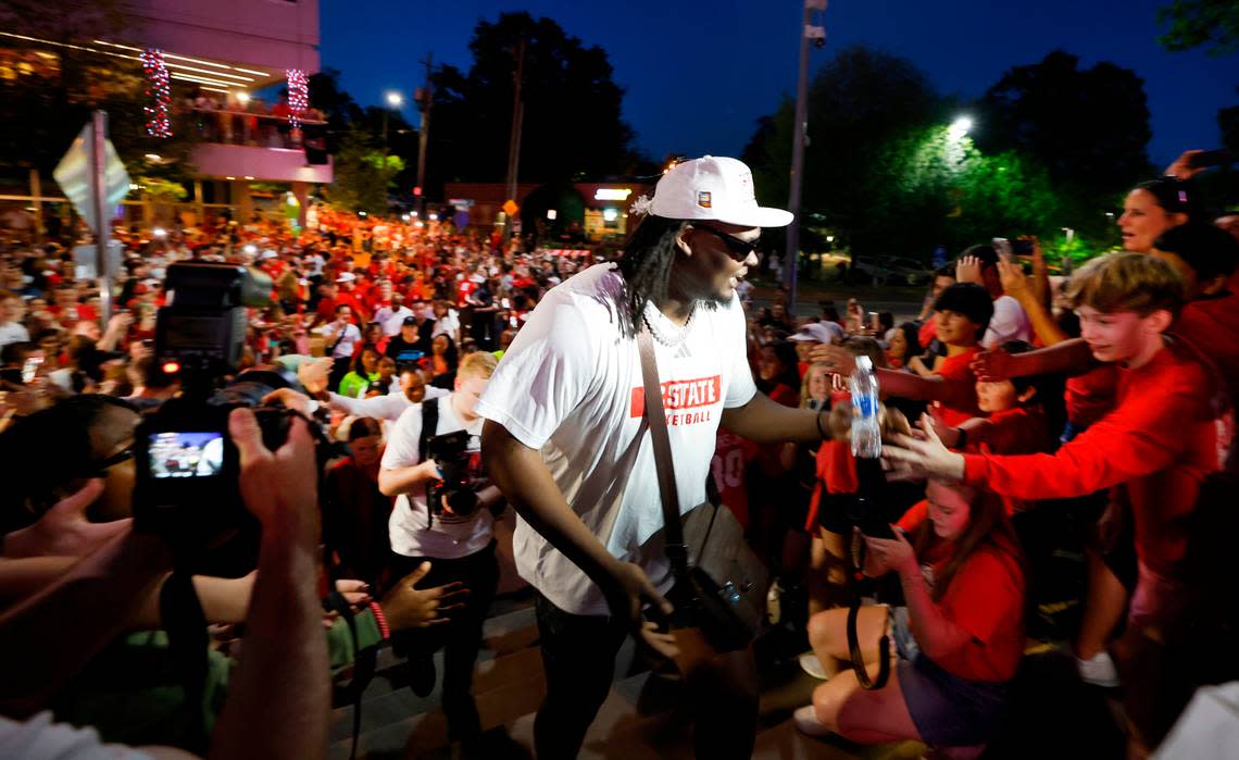 N.C. State’s DJ Burns Jr. greets fans as the team walks to the belltower during a celebration for the N.C. State men’s and women’s basketball team at the Memorial Belltower in Raleigh, N.C., Monday, April 15, 2024. Both teams made it to the NCAA Tournament Final Four and the men’s team won the ACC Championship by winning five games in five days.