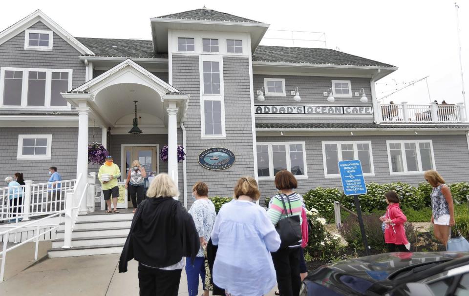 Diners wait outside Haddad's Ocean Café in Brant Rock for a table inside.