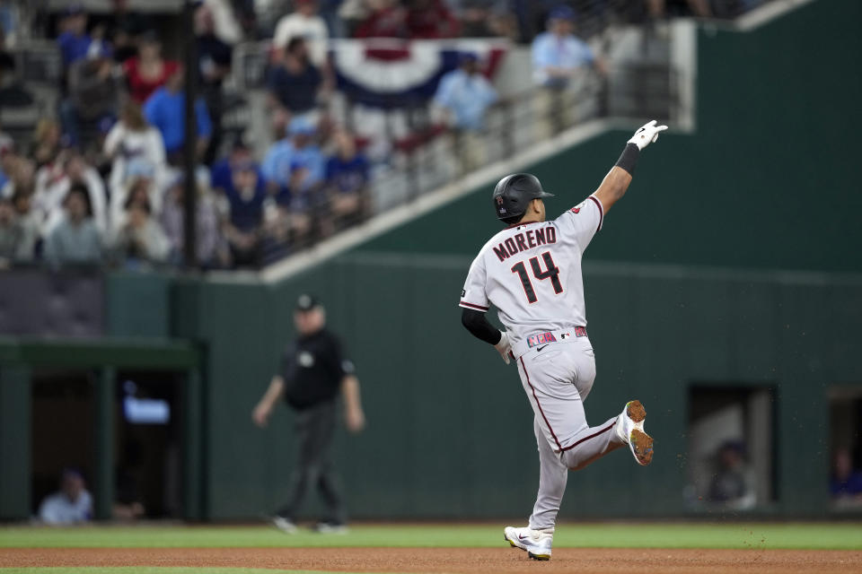 Arizona Diamondbacks' Gabriel Moreno celebrates after hitting a home run against the Texas Rangers during the fourth inning in Game 2 of the baseball World Series Saturday, Oct. 28, 2023, in Arlington, Texas. (AP Photo/Godofredo A. Vásquez)