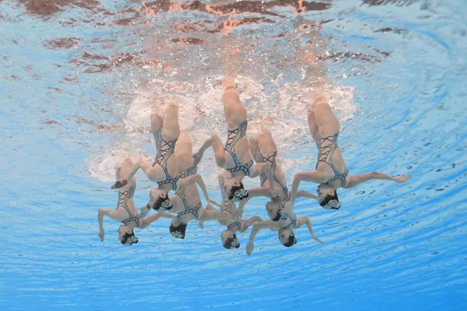 China team compete in the mixed team free final of artistic swimming at the World Aquatics Championships in Doha, Qatar, Friday, Feb. 9, 2024. (AP Photo/Lee Jin-man)
