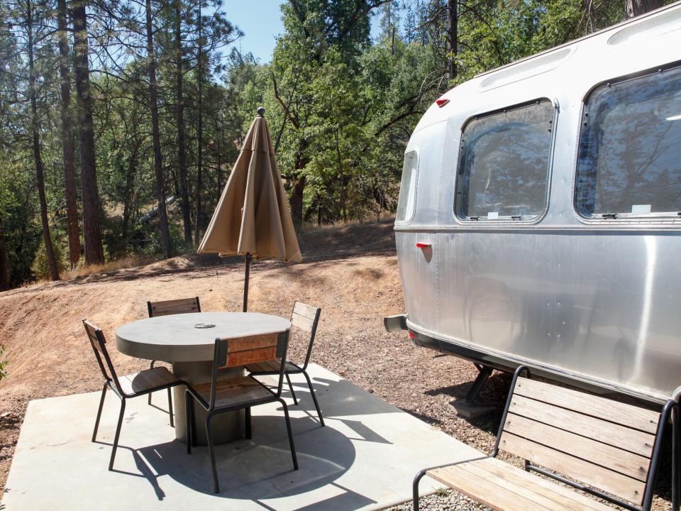 Exterior of the Airstream and outdoor seating