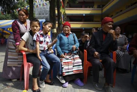 Family members of Nepali mountaineering guides, who lost their lives in an avalanche on Mount Everest, wait for the bodies of their loved ones to arrive at Sherpa Monastery in Kathmandu April 19, 2014. REUTERS/Navesh Chitrakar