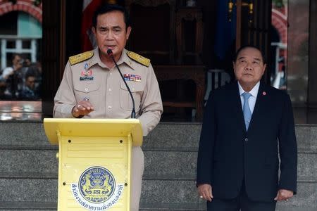 Thailand's Prime Minister Prayuth Chan-ocha speaks during a news conference after his meeting with National Security Council as Deputy Prime Minister and Defence Minister Prawit Wongsuwan listens at Government House in Bangkok, Thailand, August 15, 2016. REUTERS/Chaiwat Subprasom