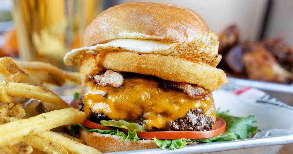 The “Hangover Burger” Hurricane Grill & Wings, which has several locations across the Treasure Coast, is a half-pound burger served with crispy bacon, fried egg, jumbo onion rings, tomatoes, cheddar cheese, lettuce and pickles on brioche bun.