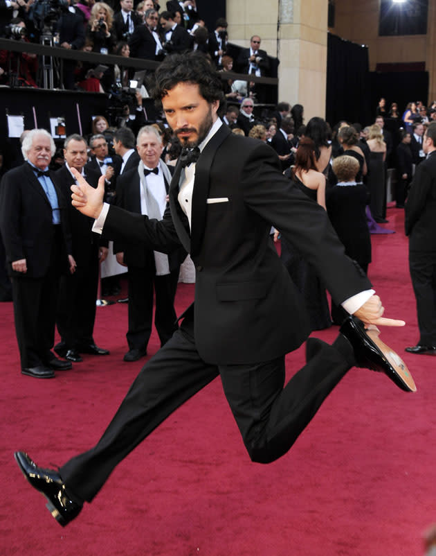 <b>Oscars 2012: Red carpet photos</b><br><br><b>Oscar-winner</b>Brett McKenzie jumping around the red carpet. He went on to win for Best Song.