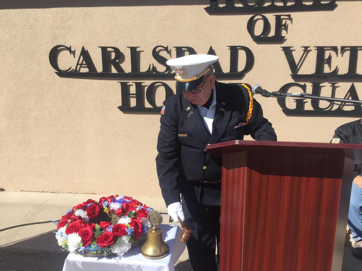 Alberto Villegas rings a bell honoring veteran's during a ceremony in Carlsbad on Nov. 11, 2022.