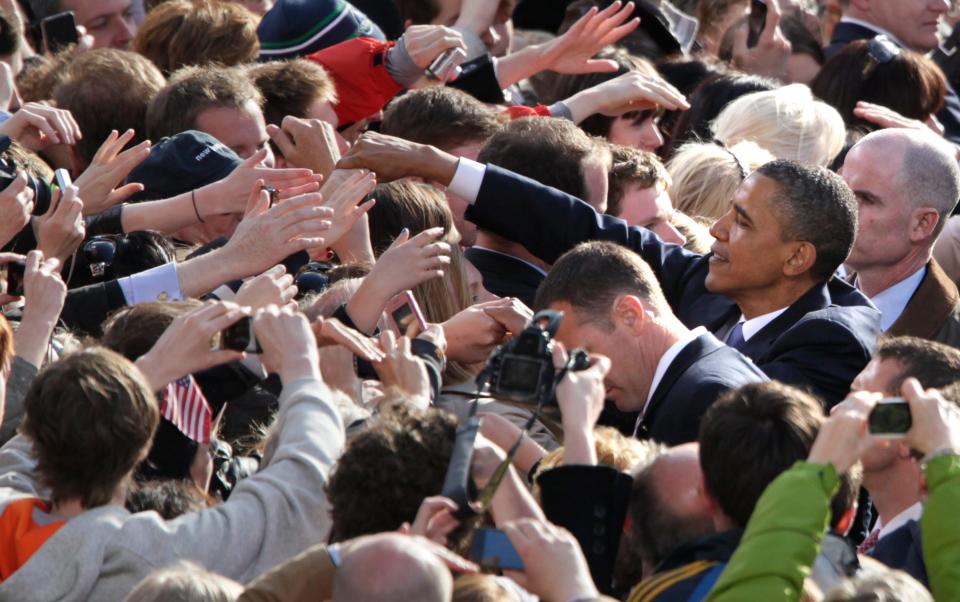 President Barack Obama shakes hands with people in the crowd after speaking at College Green in Dublin, Ireland, Monday, May 23, 2011.