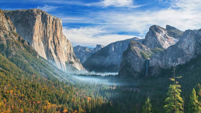 Huge granite cliffs and waterfalls over a valley