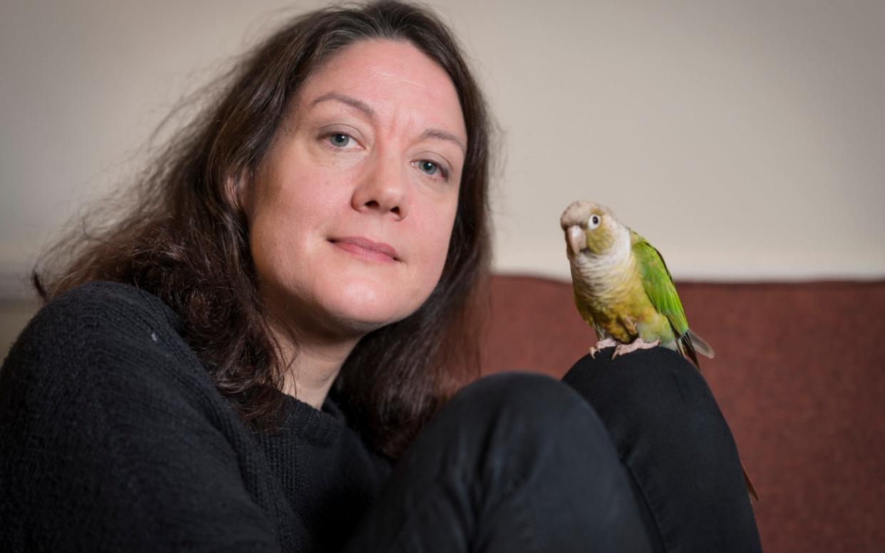 Helen Macdonald with her green-cheeked conure, Birdoole - Andrew Crowley