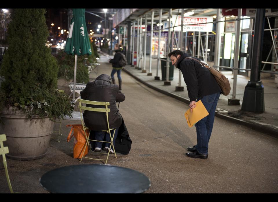 Joe Hallmark, right asks Nancy Demmett if she needs assistance during a homeless count in New York. The New York City Department of Homeless Services assisted by volunteers put on a homeless count in the borough of Manhattan's Murray Hill neighborhood Jan. 30, 2012. (Damon Dahlen, AOL)