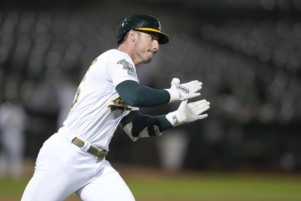 Oakland Athletics' Brent Rooker celebrates after hitting a two-run home run during the ninth inning of a baseball game against the Kansas City Royals in Oakland, Calif., Monday, Aug. 21, 2023. (AP Photo/Jeff Chiu)