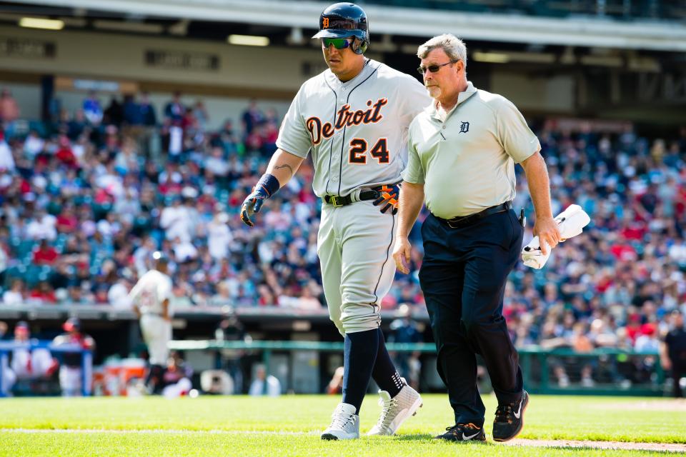 Miguel Cabrera walks off the field with trainer Kevin Rand after an apparent injury during the eighth inning of the Tigers' 4-1 win over the Indians at Progressive Field on April 16, 2017 in Cleveland.