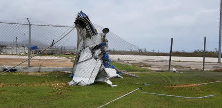 A destroyed airplane sits tangled in fencing after Super Typhoon Yutu hit Saipan, Northern Mariana Islands, U.S., October 25, 2018. Brad Ruszala via REUTERS