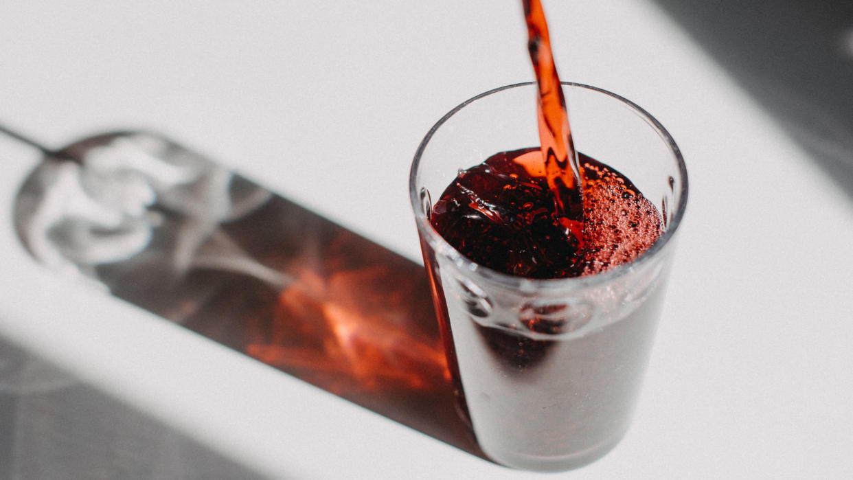  Tart cherry juice poured into a clear glass. 