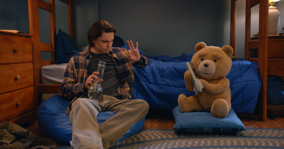 TED -- "My Two Dads" Episode 102 -- Pictured: (l-r) Max Burkholder as John, Seth MacFarlane as voice of Ted (Photo by: PEACOCK)