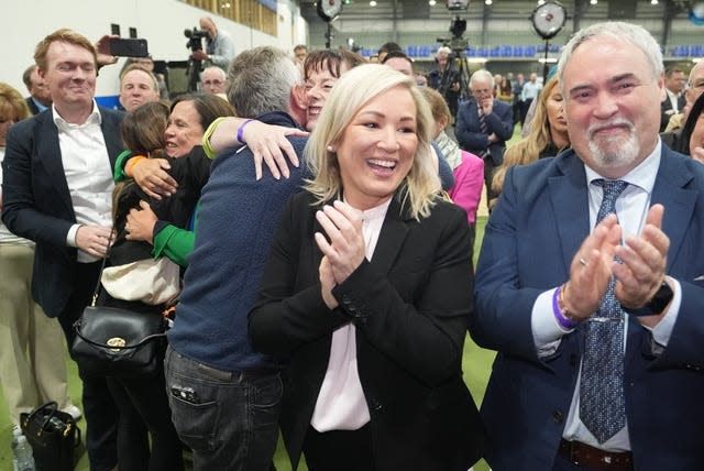 Sinn Fein vice president Michelle O'Neil clapping with Sinn Fein supporters