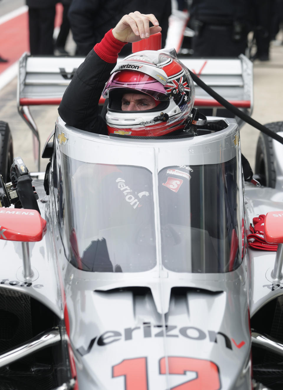 IndyCar driver Will Power lowers into his car as he prepares to drive in IndyCar Series Open Testing, Wednesday, Feb. 12, 2020, in Austin, Texas. (AP Photo/Eric Gay)