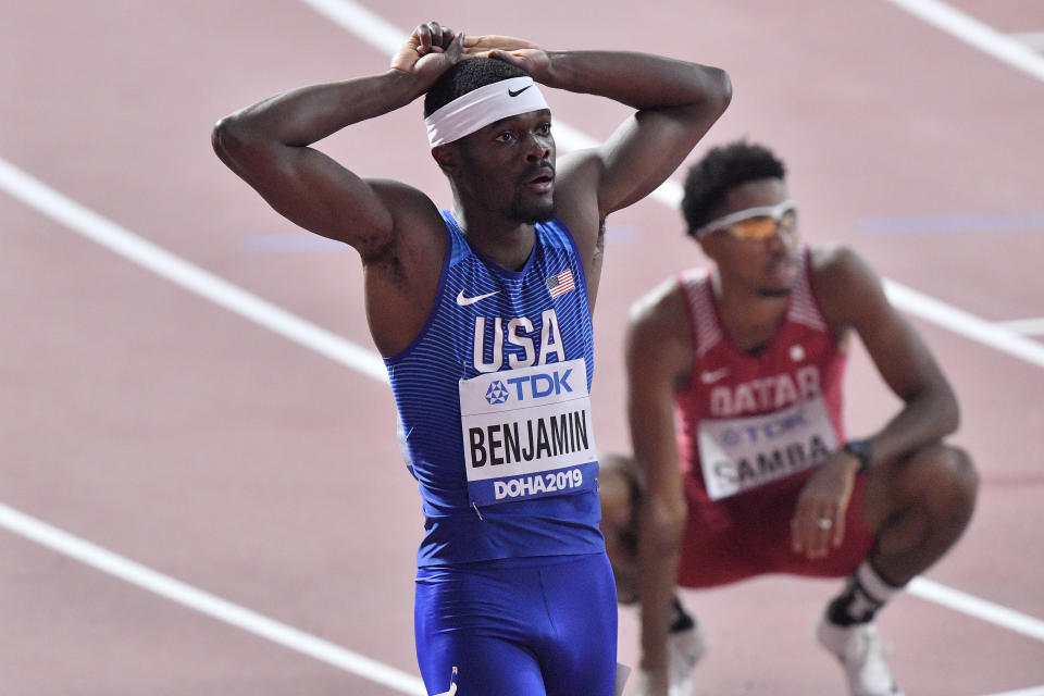 Rai Benjamin, of the United States, and Abderrahman Samba, of Qatar, background, react after finishing a men's 400 meter hurdles race semifinal during the World Athletics Championships in Doha, Qatar, Saturday, Sept. 28, 2019. (AP Photo/Martin Meissner)