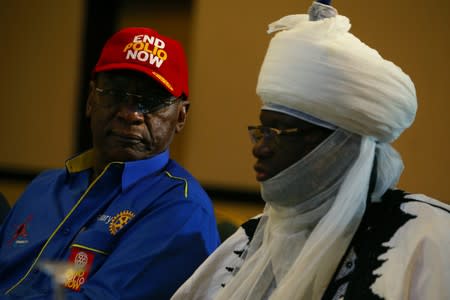 Chairman Nigeria National PolioPlus Committee of Rotary International, Dr. Tunji Funsho and Emir of Jiwa HRH Idris Musa are seen during a news conference marking the 3-year-polio-free milestone in Abuja