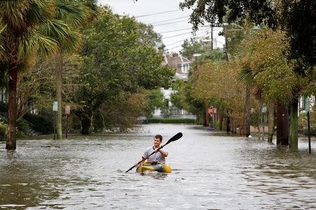 A resident kayaks in flood waters on Rutledge Avenue after Hurricane Matthew hit Charleston, South Carolina October 8, 2016. REUTERS/Jonathan Drake