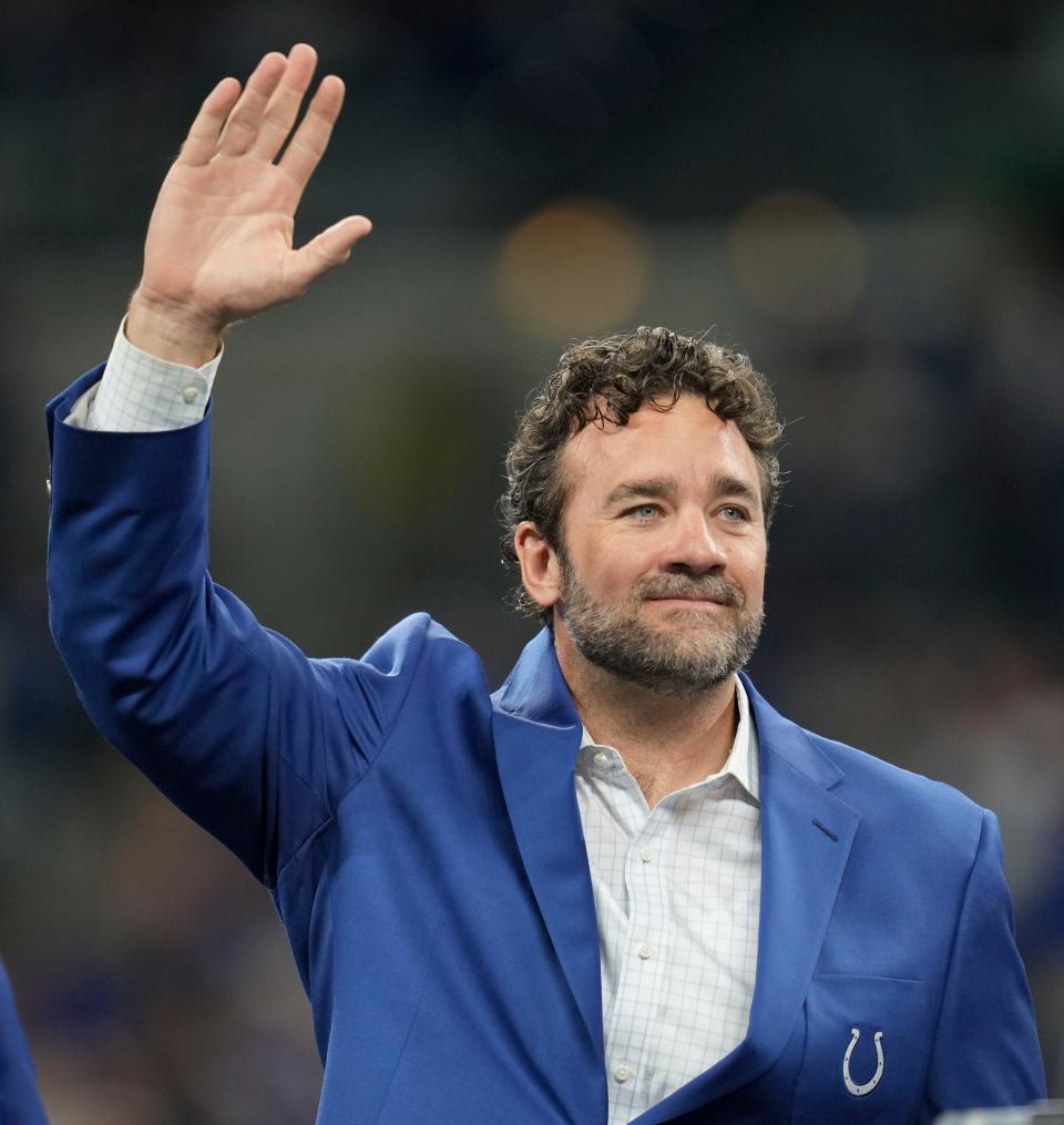 Former Indianapolis Colts player Jeff Saturday waves to the crowd during a Ring of Honor induction ceremony for Tarik Glenn on Sunday, Oct. 30, 2022, during a game against the Washington Commanders at Indianapolis Colts at Lucas Oil Stadium in Indianapolis.