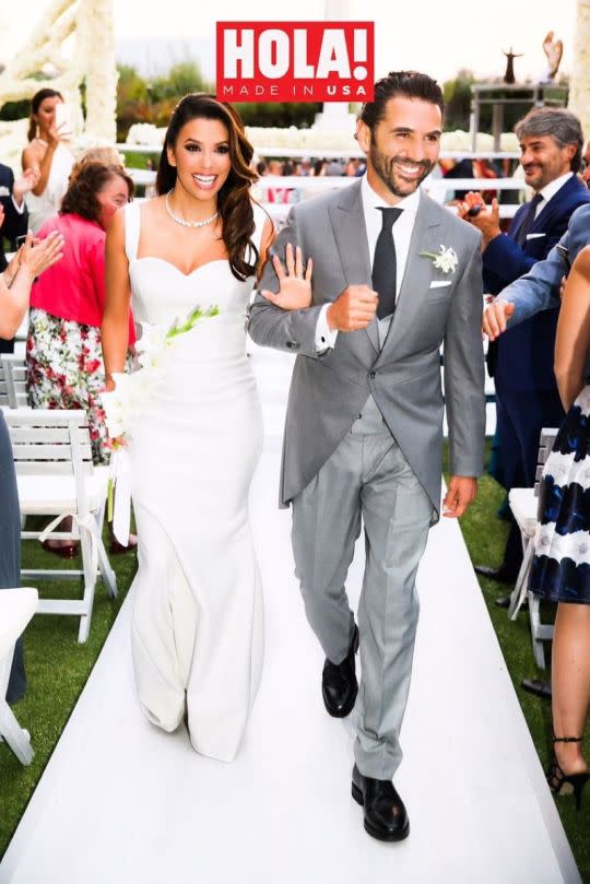 Eva Longoria and José Antonio Bastón walk down the aisle. 