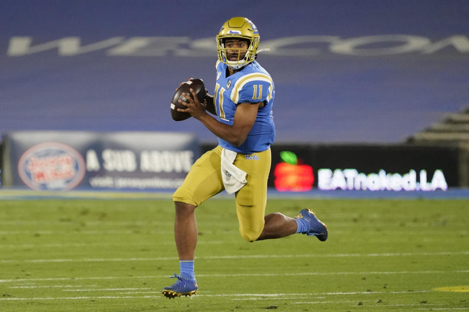 UCLA quarterback Chase Griffin runs against Arizona during the first half of an NCAA college football game Saturday, Nov. 28, 2020, in Pasadena, Calif. (AP Photo/Marcio Jose Sanchez)