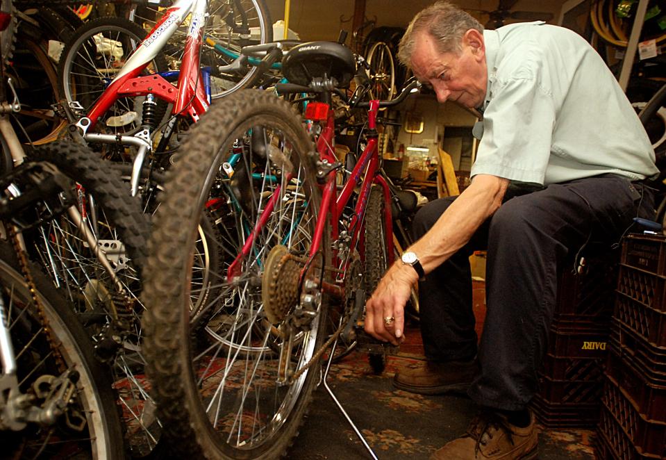 Howard Welch owner of Welch's Bicycle & Ski Shop fixes a bike Tuesday Aug. 9, 2011 at the shop on Whitesboro Street in Utica.